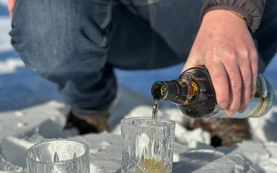 Whisky poured over glacier ice on a landing site
